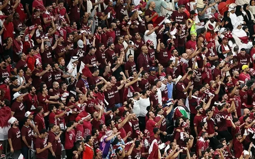Football supporters in the stands before a match