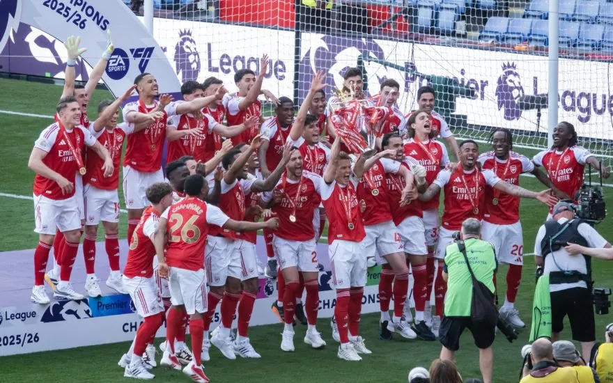 Arsenal players lift the Premier League trophy after securing the 2025-26 Premier League title in May 2026